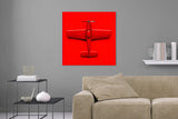 Aufgehängte Stilllife Fotografie von einem roten Spielzeug Flugzeug auf rotem Hintergrund im quadratischen Format. Fotokunst und Bilder online kaufen. Wandbild hinter Acrylglas oder als Poster